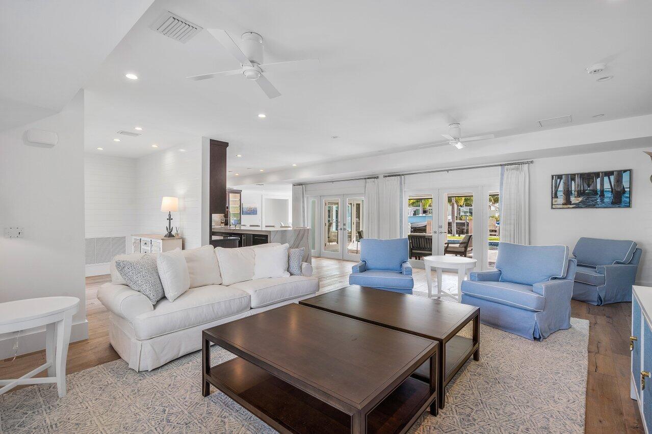 1041 Gulfstream Way Singer Island, FL 33404 - Photo 8 of 41 a living room with furniture a rug and a view of kitchen