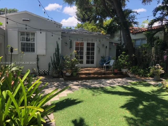 551 Northeast 69th Street, Unit 1&2 Miami, FL 33138 - Photo 13 of 15 a front view of a house with garden