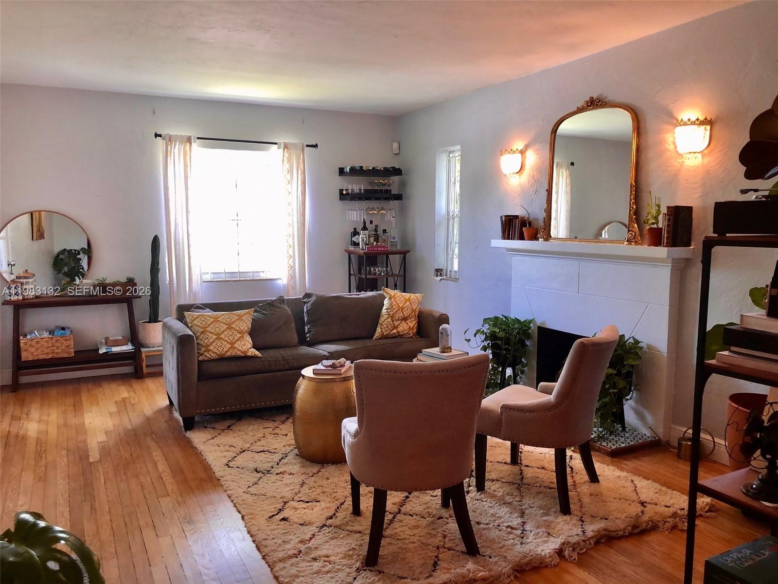 551 Northeast 69th Street, Unit 1&2 Miami, FL 33138 - Photo 3 of 15 a living room with furniture and wooden floor