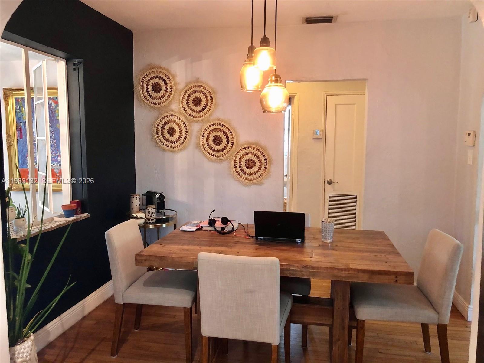 551 Northeast 69th Street, Unit 1&2 Miami, FL 33138 - Photo 4 of 15 a view of a dining room with furniture and window