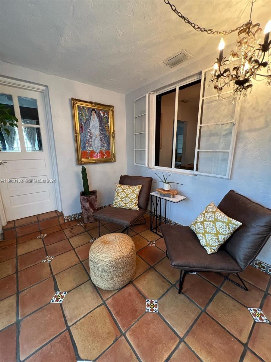551 Northeast 69th Street, Unit 1&2 Miami, FL 33138 - Photo 9 of 15 a living room with furniture and a rug