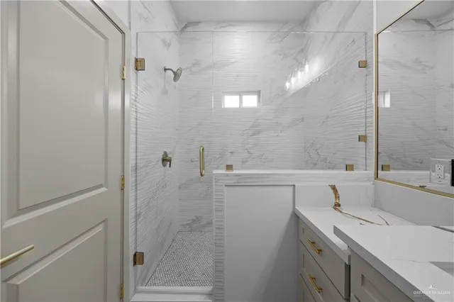 a bathroom with a shower and a sink