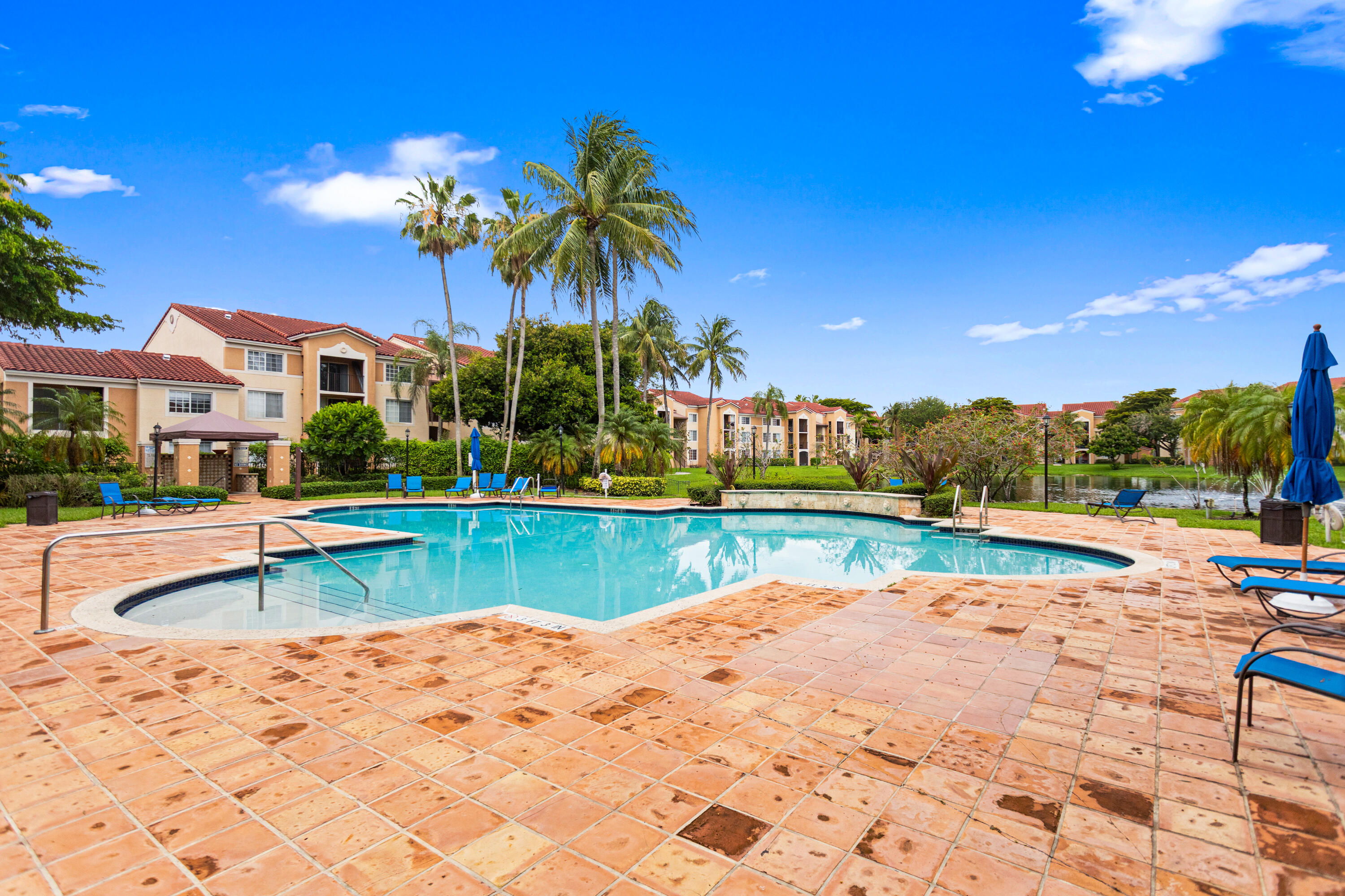 2113 Renaissance Boulevard, Unit 306 Miramar, FL 33025 - Photo 51 of 59 a view of swimming pool with outdoor seating and city view