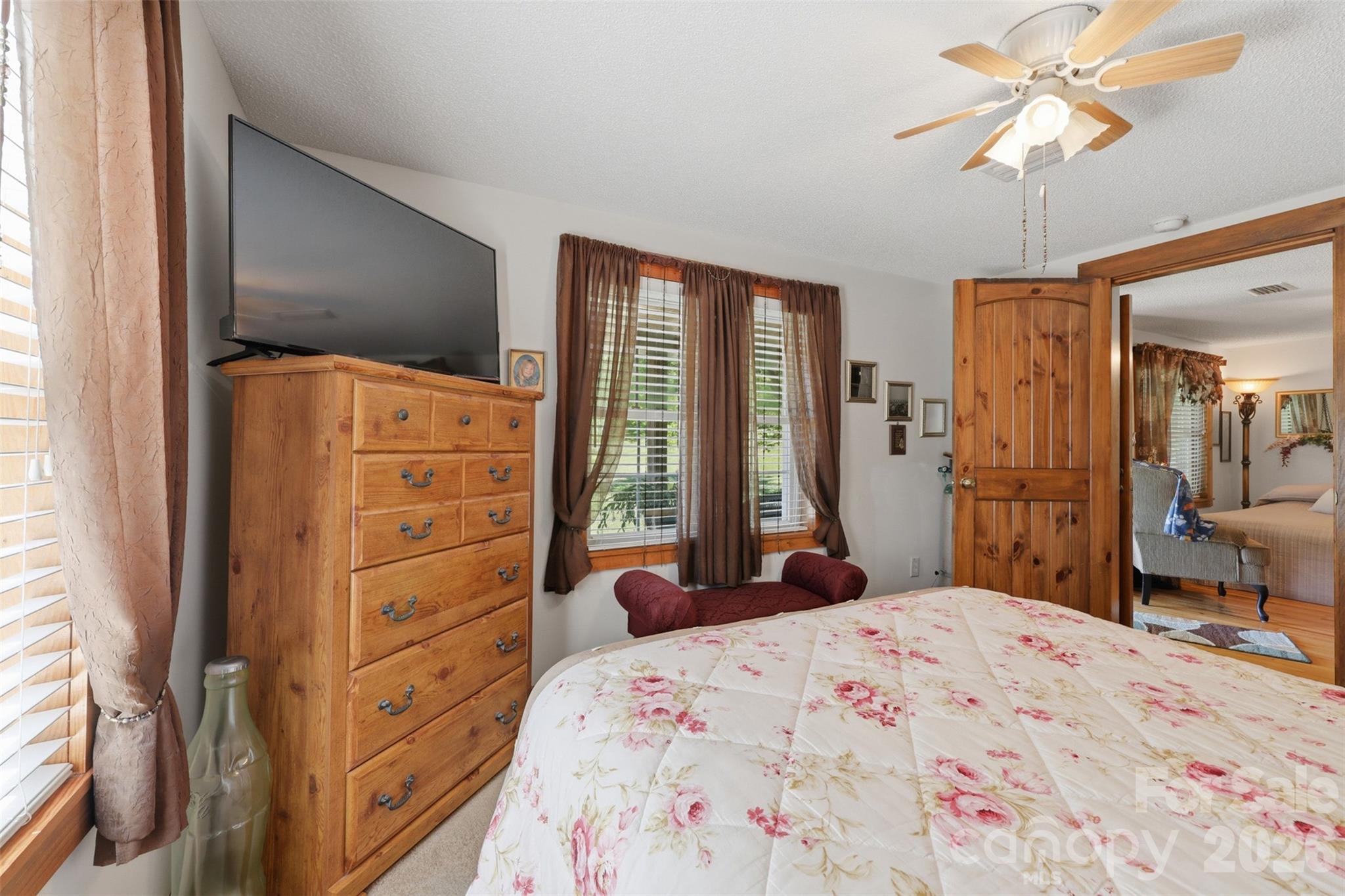 176-174 Oak Hollow Road Union Grove, NC 28689 - Photo 26 of 48 a bedroom with a bed dresser and a large window