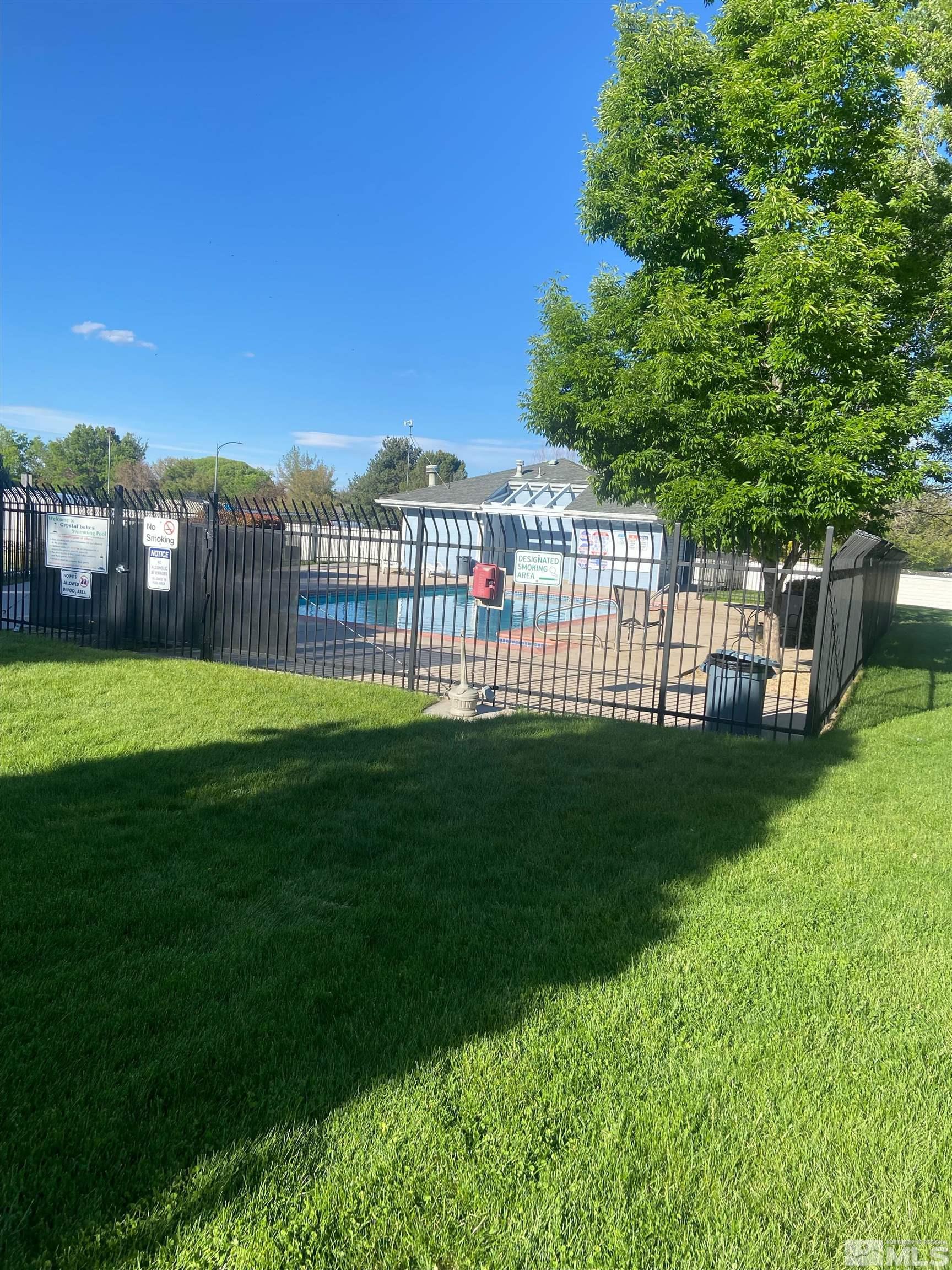 860 Swaledale Drive Reno, NV 89511 - Photo 5 of 19 a view of a garden with a house in the background