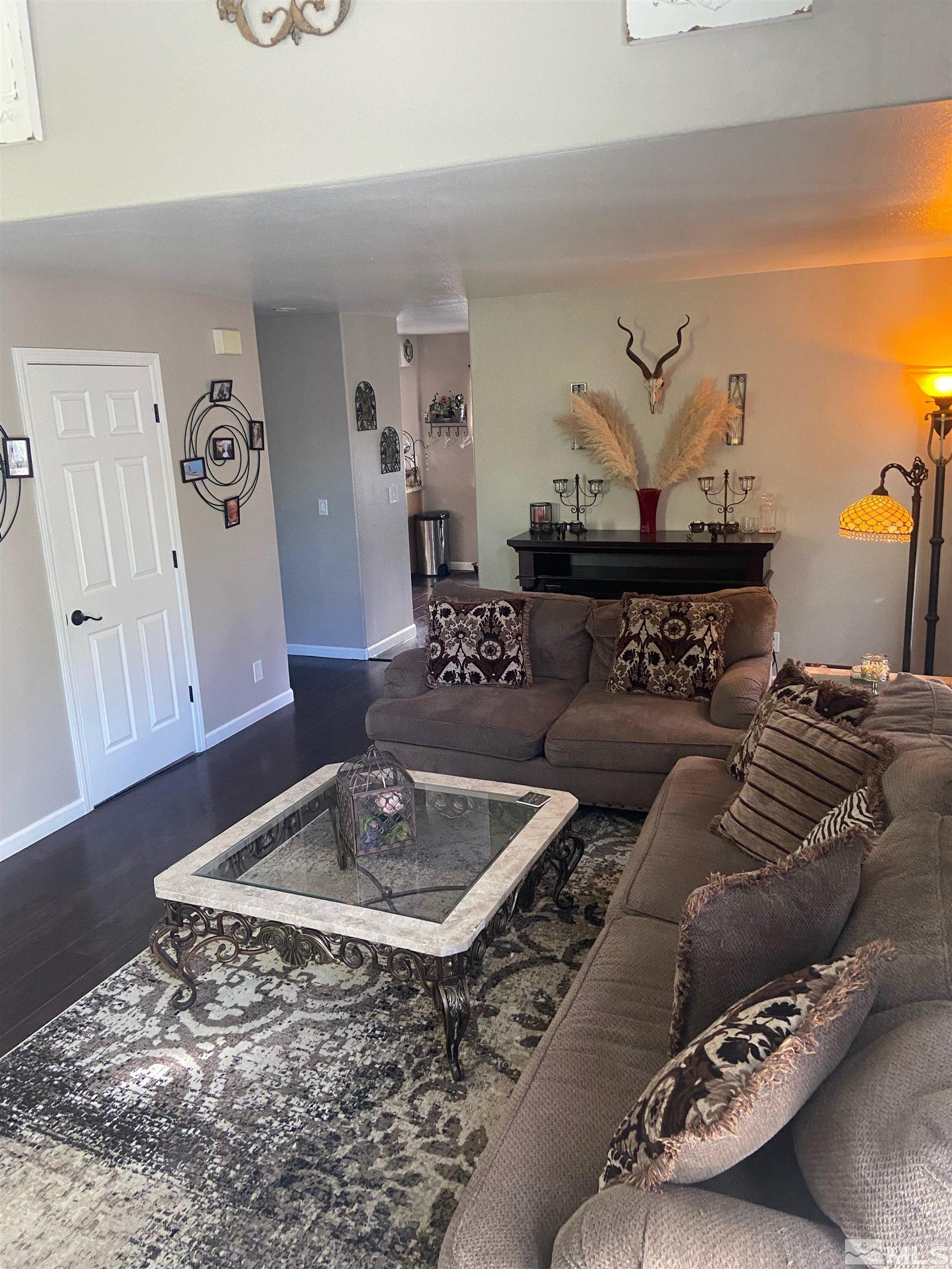 860 Swaledale Drive Reno, NV 89511 - Photo 7 of 19 a living room with furniture and a rug