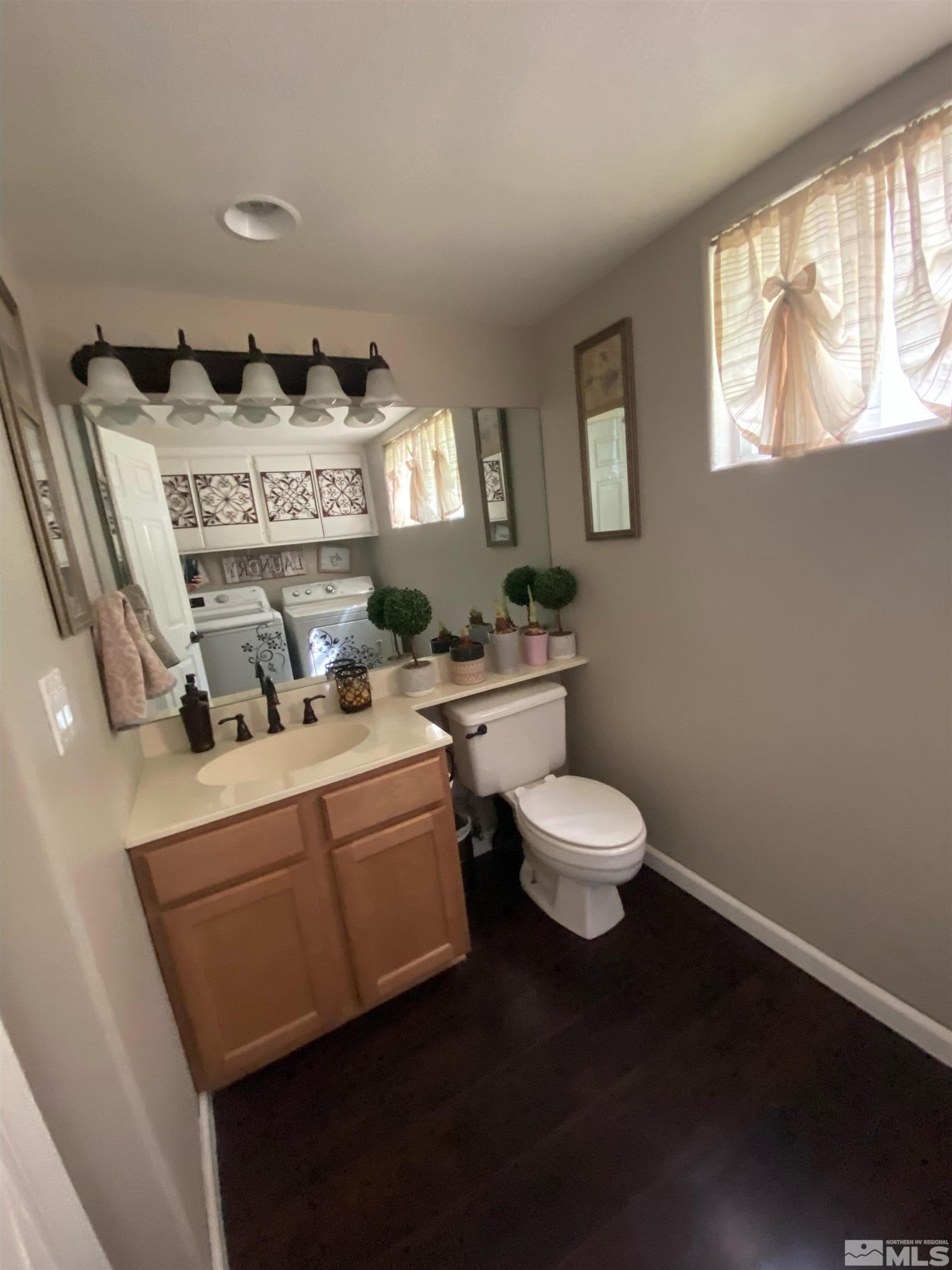 860 Swaledale Drive Reno, NV 89511 - Photo 8 of 19 a very nice looking room with a chair and a large window