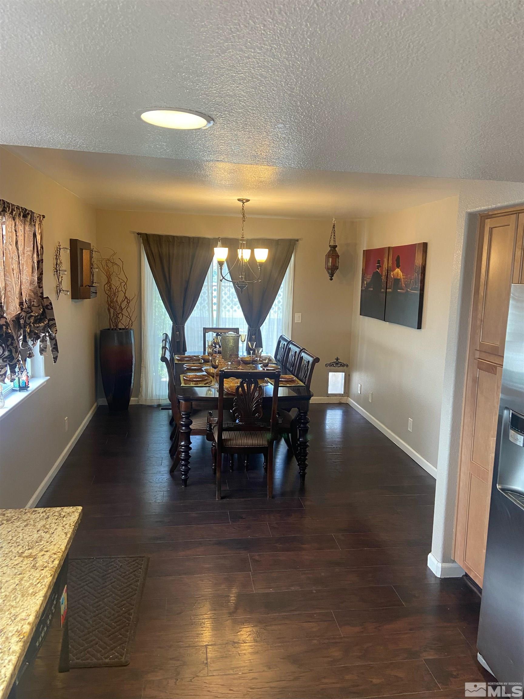 860 Swaledale Drive Reno, NV 89511 - Photo 10 of 19 a view of a dining room with furniture and wooden floor