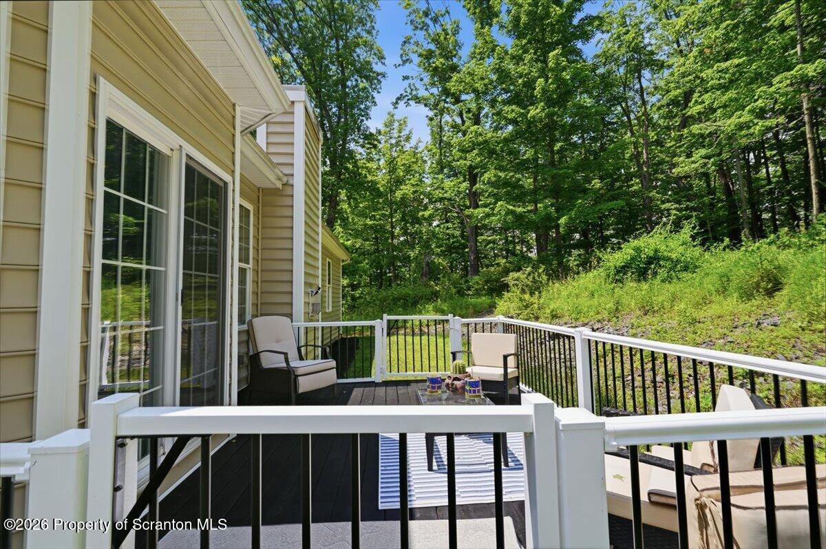 99 Hilltop Road Waverly, PA 18471 - Photo 38 of 41 a view of a chair and table in the balcony