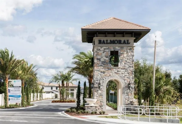 a view of swimming pool with outdoor seating and lake view