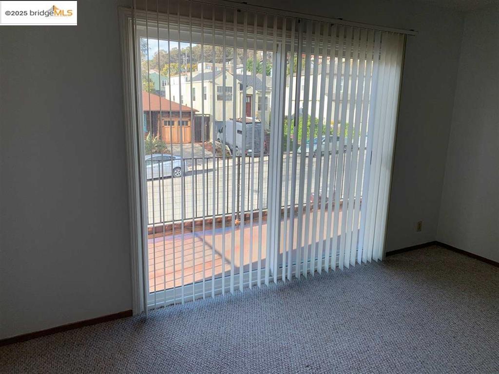 708 Solano Avenue, Unit D Albany, CA 94706 - Photo 11 of 23 Unfurnished room with carpet flooring and baseboards