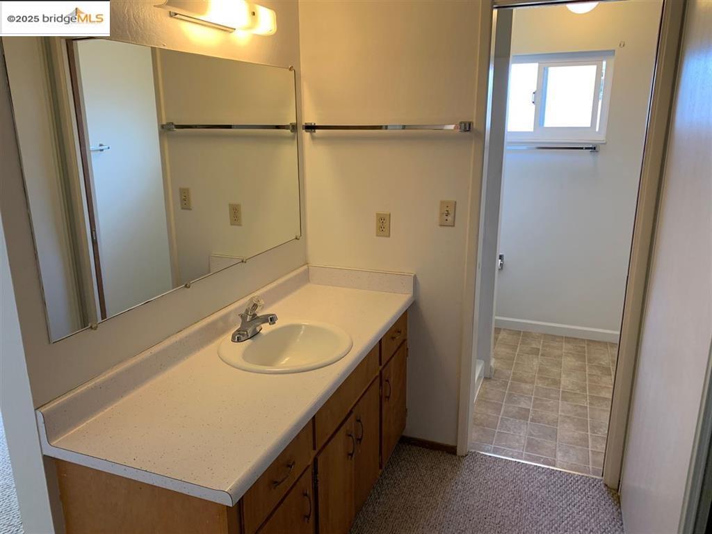 708 Solano Avenue, Unit D Albany, CA 94706 - Photo 14 of 23 Bathroom featuring vanity and baseboards