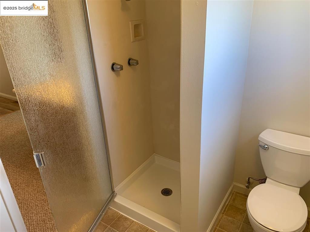 708 Solano Avenue, Unit D Albany, CA 94706 - Photo 15 of 23 Full bath featuring a stall shower and tile patterned flooring