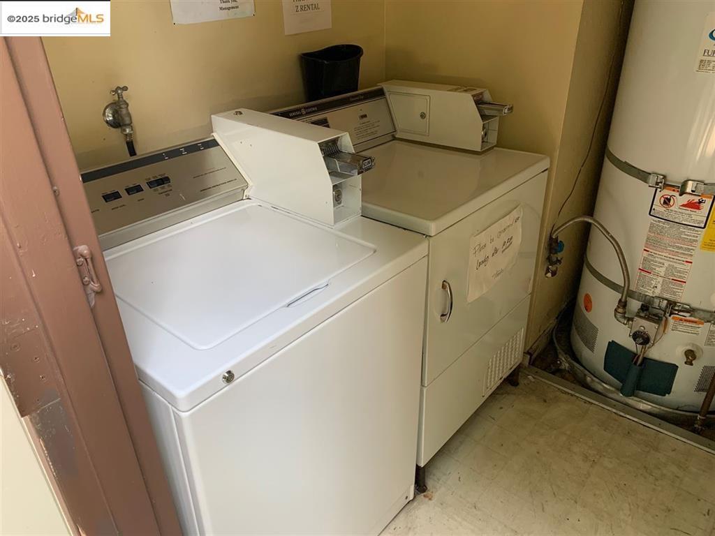 708 Solano Avenue, Unit D Albany, CA 94706 - Photo 22 of 23 Laundry room with water heater, light floors, and washing machine and dryer