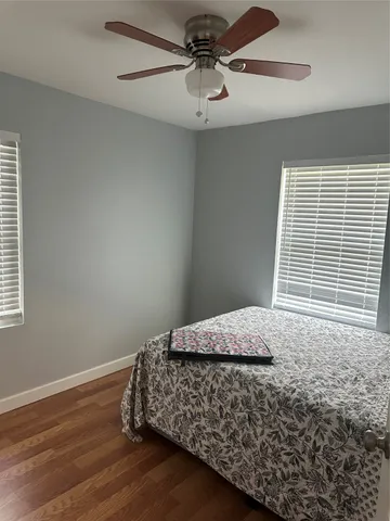 a bedroom with bed and window