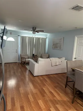 a bed room with a bed and a chair