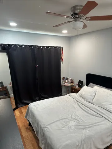 a bed room with a bed and a mirror