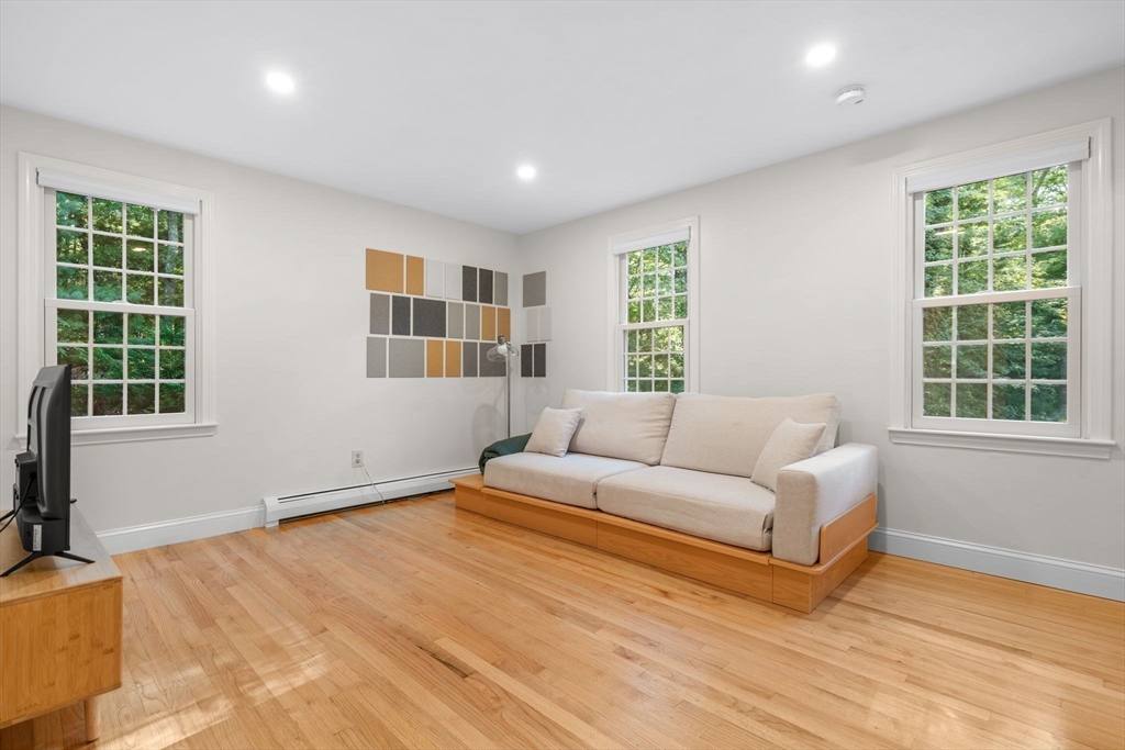 7 Hunter's Trail Sandwich, MA 02563 - Photo 14 of 27 a living room with furniture and windows