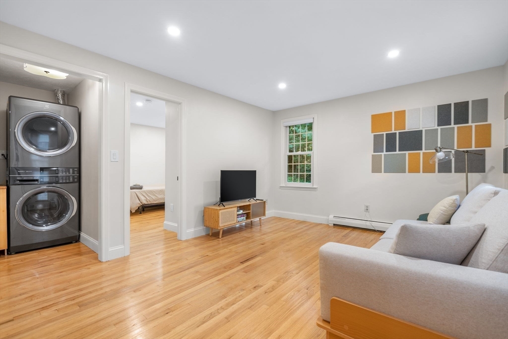 7 Hunter's Trail Sandwich, MA 02563 - Photo 16 of 27 a living room with furniture and a wooden floor