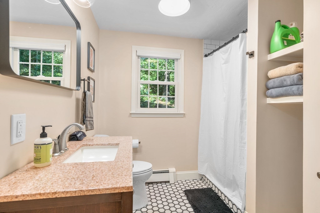 7 Hunter's Trail Sandwich, MA 02563 - Photo 18 of 27 a bathroom with a granite countertop sink and a window