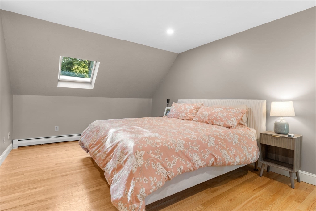 7 Hunter's Trail Sandwich, MA 02563 - Photo 24 of 27 a large bed sitting in a bedroom next to a window