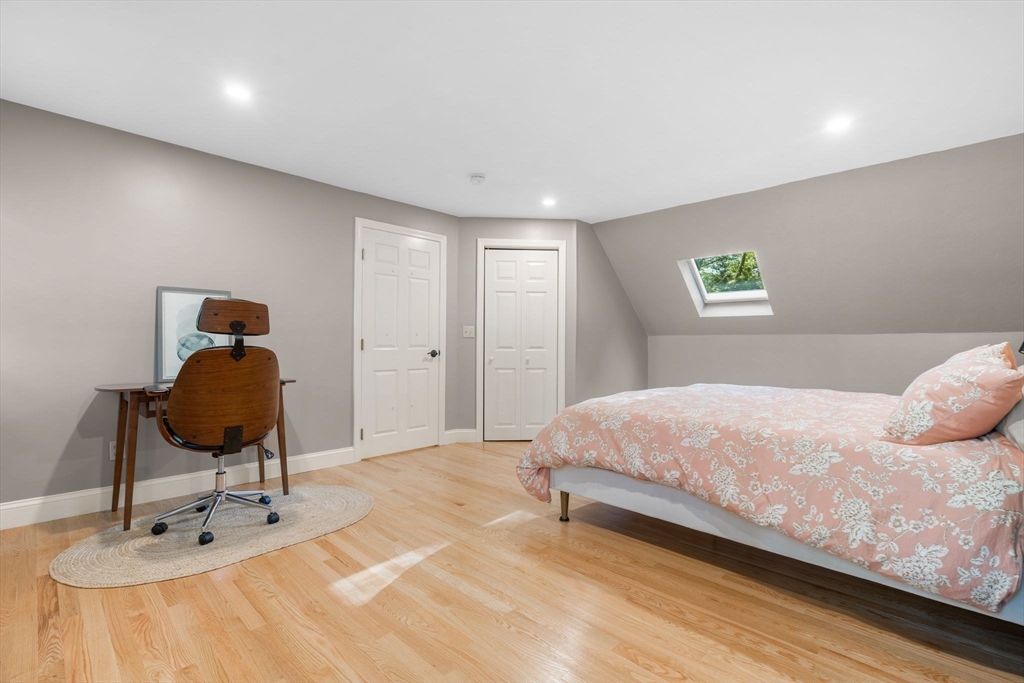 7 Hunter's Trail Sandwich, MA 02563 - Photo 25 of 27 a bedroom with a bed and a chair