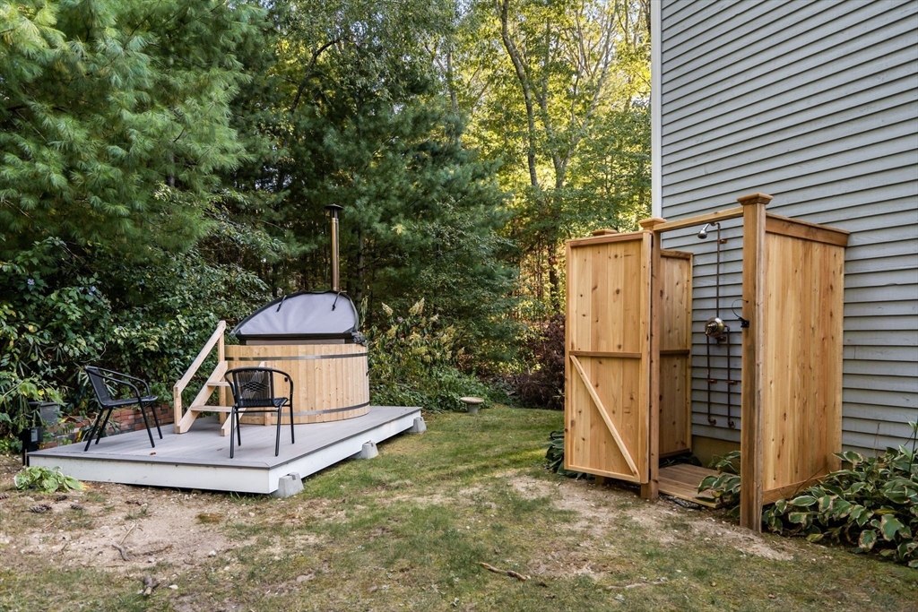 7 Hunter's Trail Sandwich, MA 02563 - Photo 5 of 27 a view of a tiny house with backyard