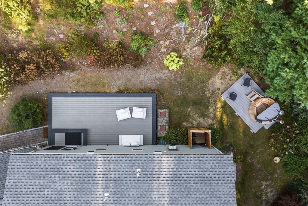 7 Hunter's Trail Sandwich, MA 02563 - Photo 6 of 27 a brick house with a tree in front of it
