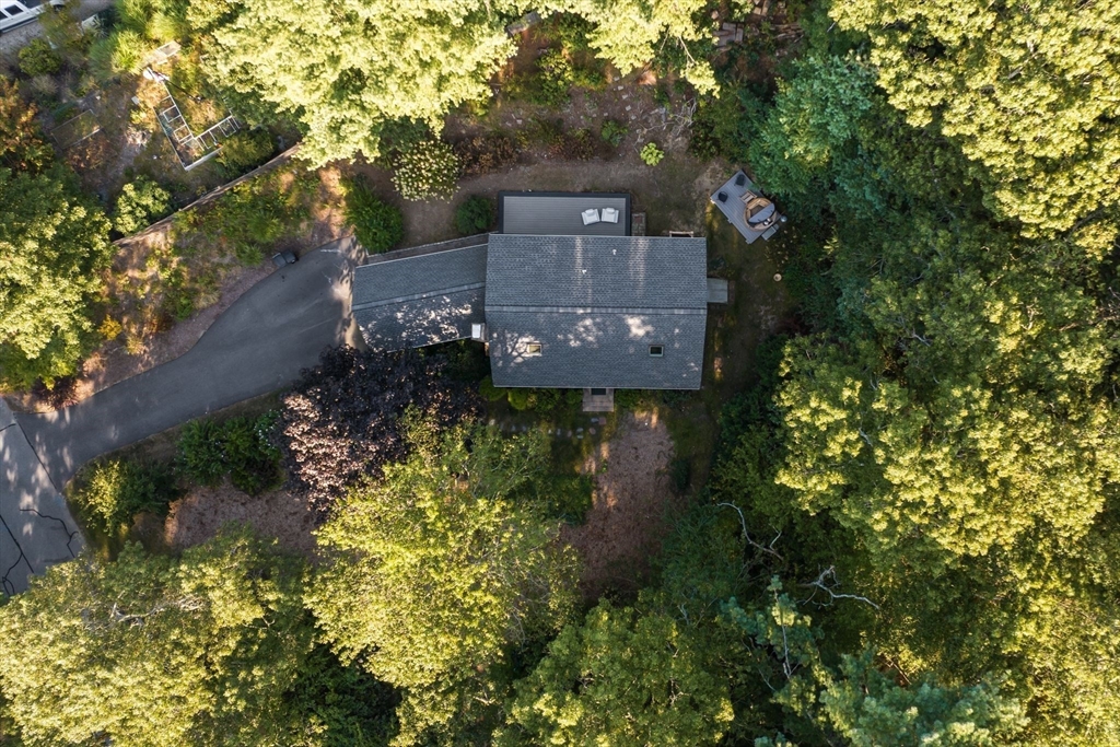7 Hunter's Trail Sandwich, MA 02563 - Photo 7 of 27 a front view of a house with a yard