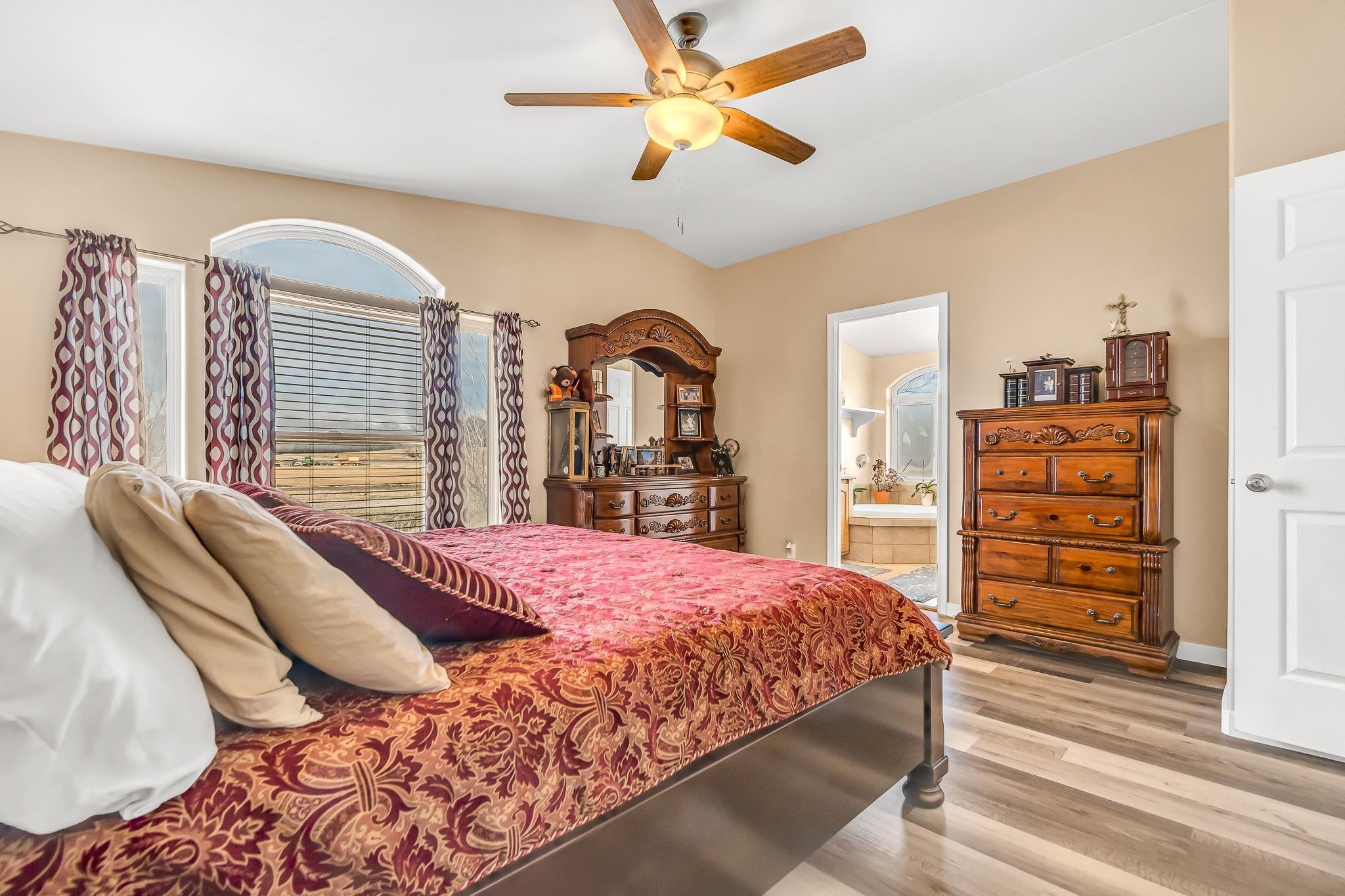 1825 M Road Fruita, CO 81521 - Photo 14 of 29 a bedroom with a bed and a chandelier