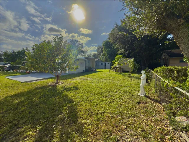a view of a yard with an outdoor space