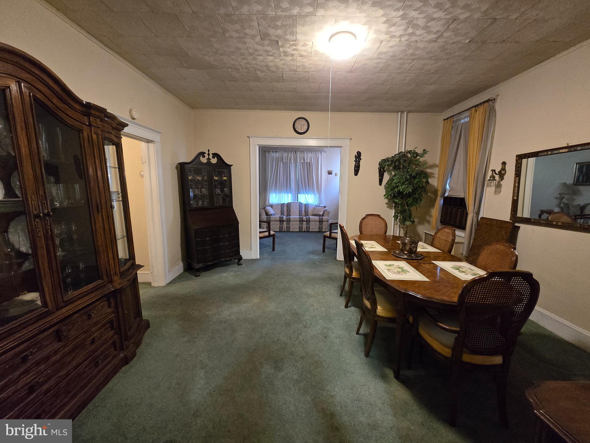 5533 Gwynn Oak Baltimore, MD 21207 - Photo 15 of 44 a living room with furniture a flat screen tv and a refrigerator