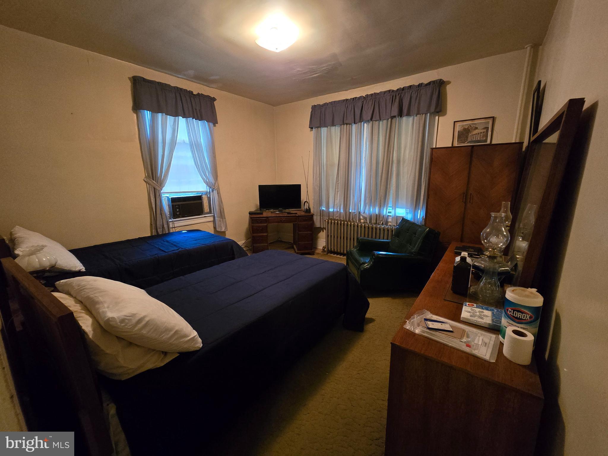 5533 Gwynn Oak Baltimore, MD 21207 - Photo 16 of 44 a bedroom with a bed and a flat tv screen