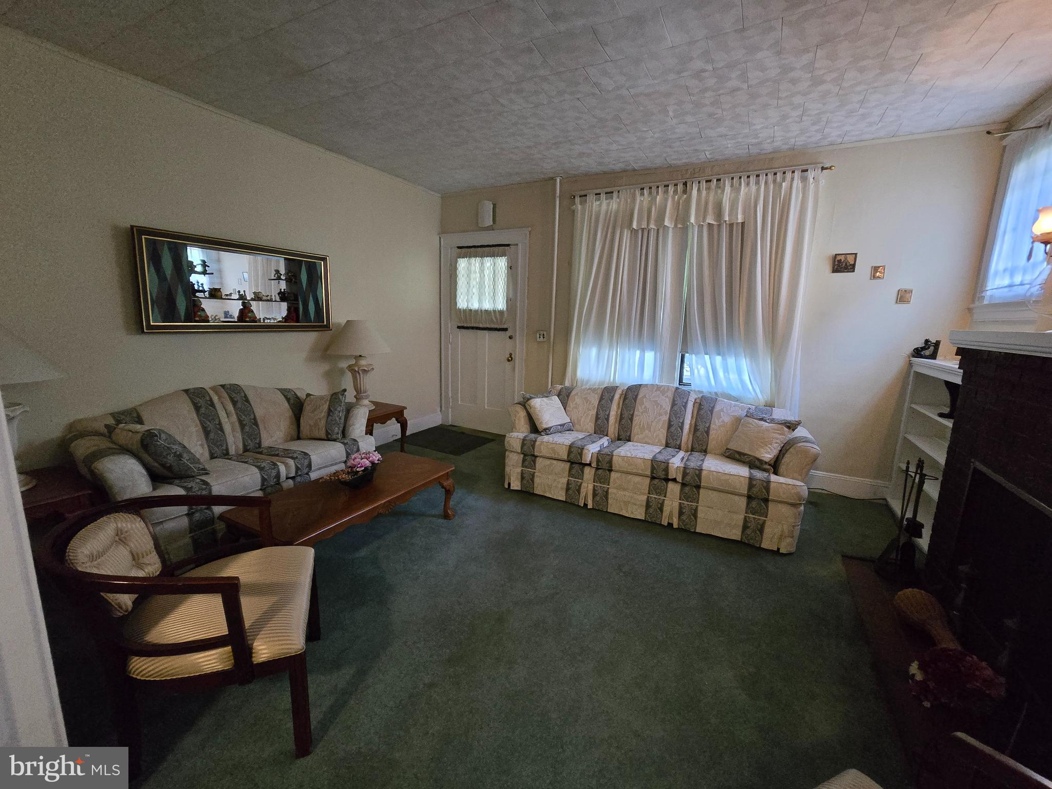5533 Gwynn Oak Baltimore, MD 21207 - Photo 17 of 44 a living room with furniture and a flat screen tv