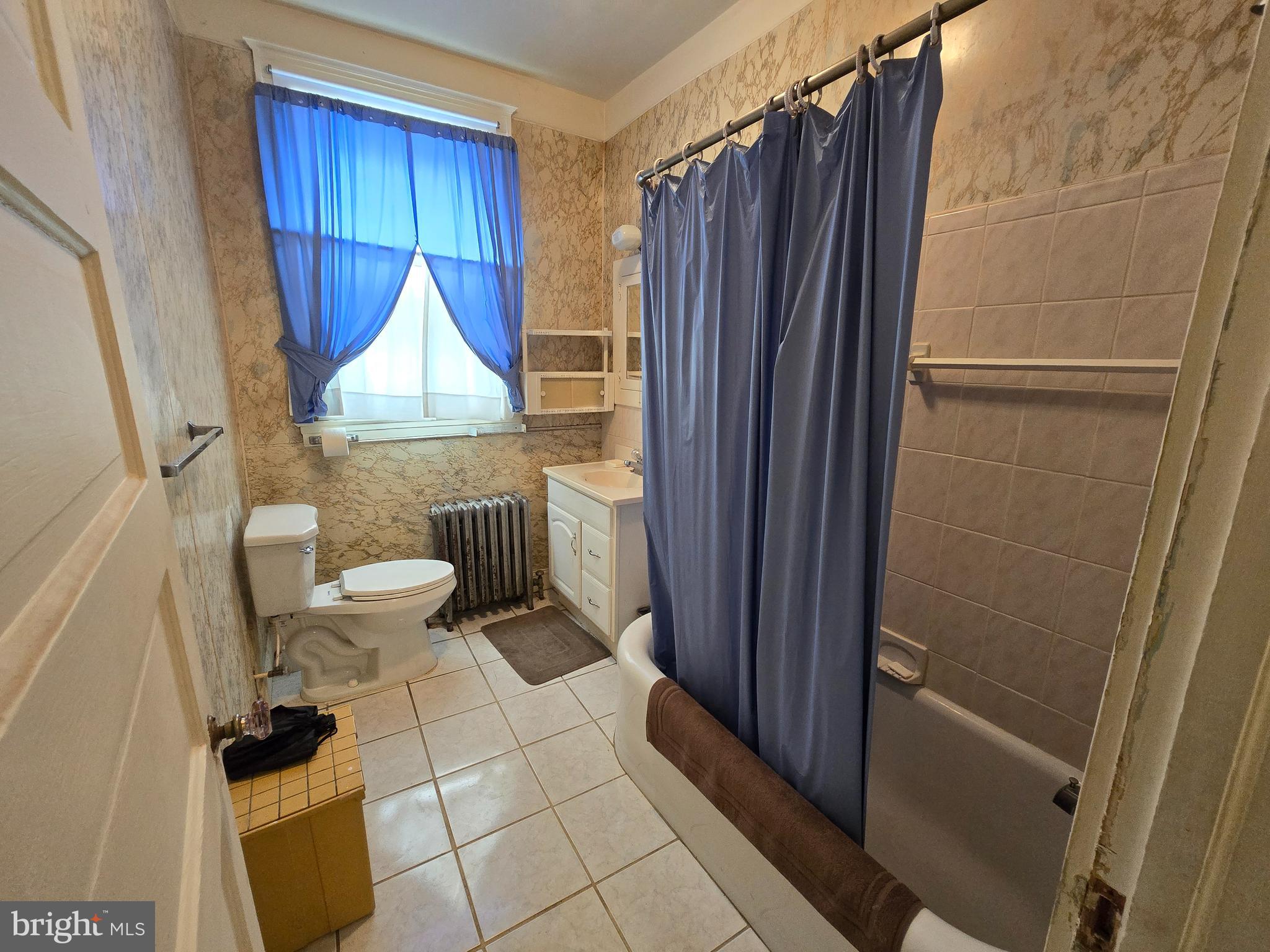 5533 Gwynn Oak Baltimore, MD 21207 - Photo 19 of 44 a bathroom with a toilet and a shower