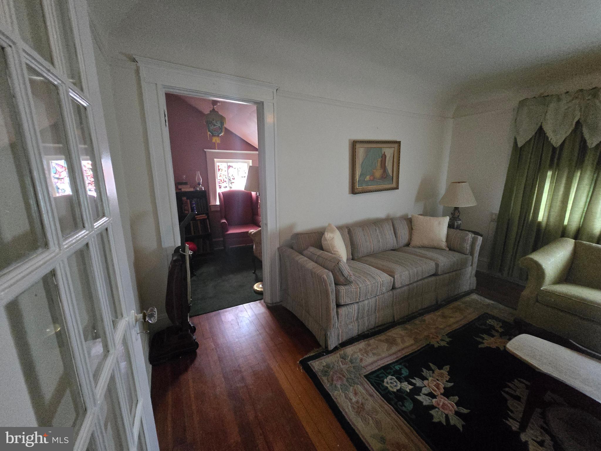5533 Gwynn Oak Baltimore, MD 21207 - Photo 35 of 44 a living room with furniture and a fireplace