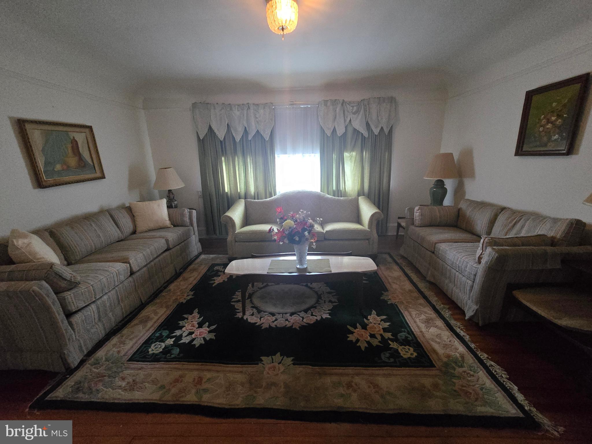5533 Gwynn Oak Baltimore, MD 21207 - Photo 36 of 44 a living room with furniture and a lamps