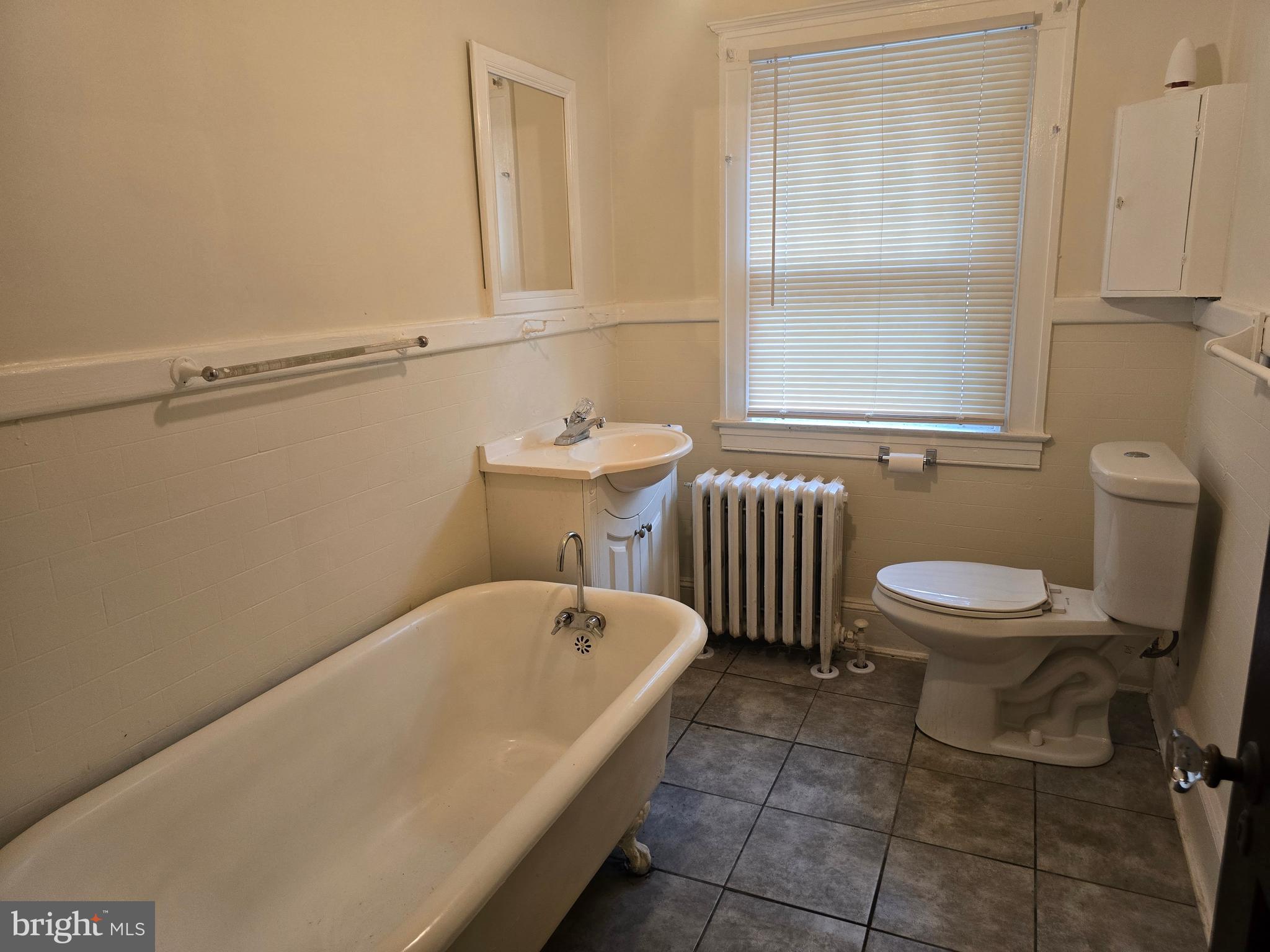 5533 Gwynn Oak Baltimore, MD 21207 - Photo 37 of 44 a bathroom with a sink a toilet and a bathtub