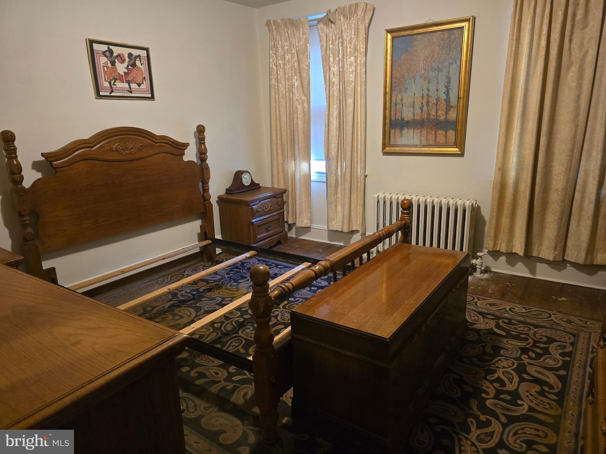 5533 Gwynn Oak Baltimore, MD 21207 - Photo 38 of 44 a blue bed sitting in a bedroom next to a window