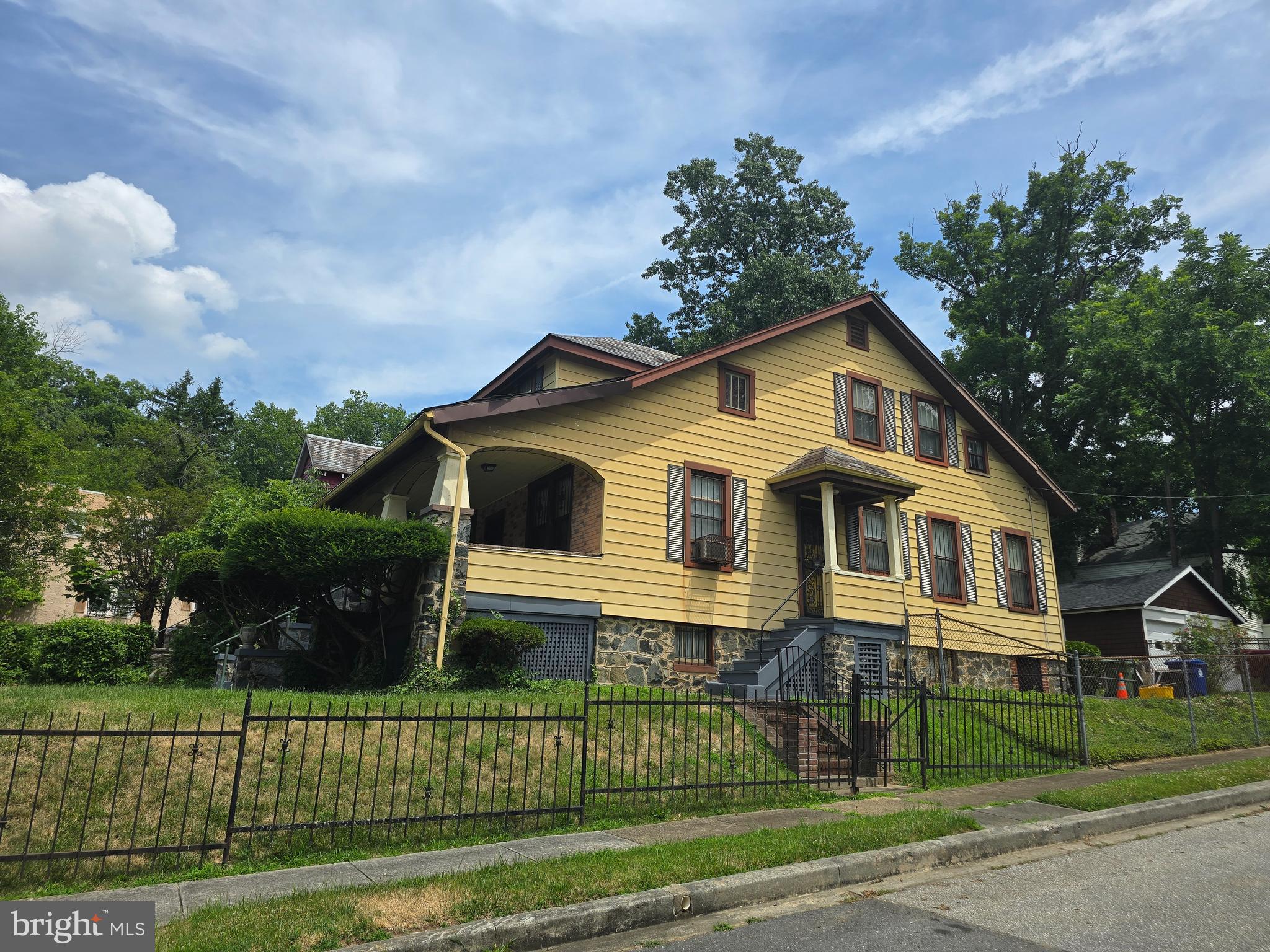 5533 Gwynn Oak Baltimore, MD 21207 - Photo 4 of 44 a front view of a house with a small yard
