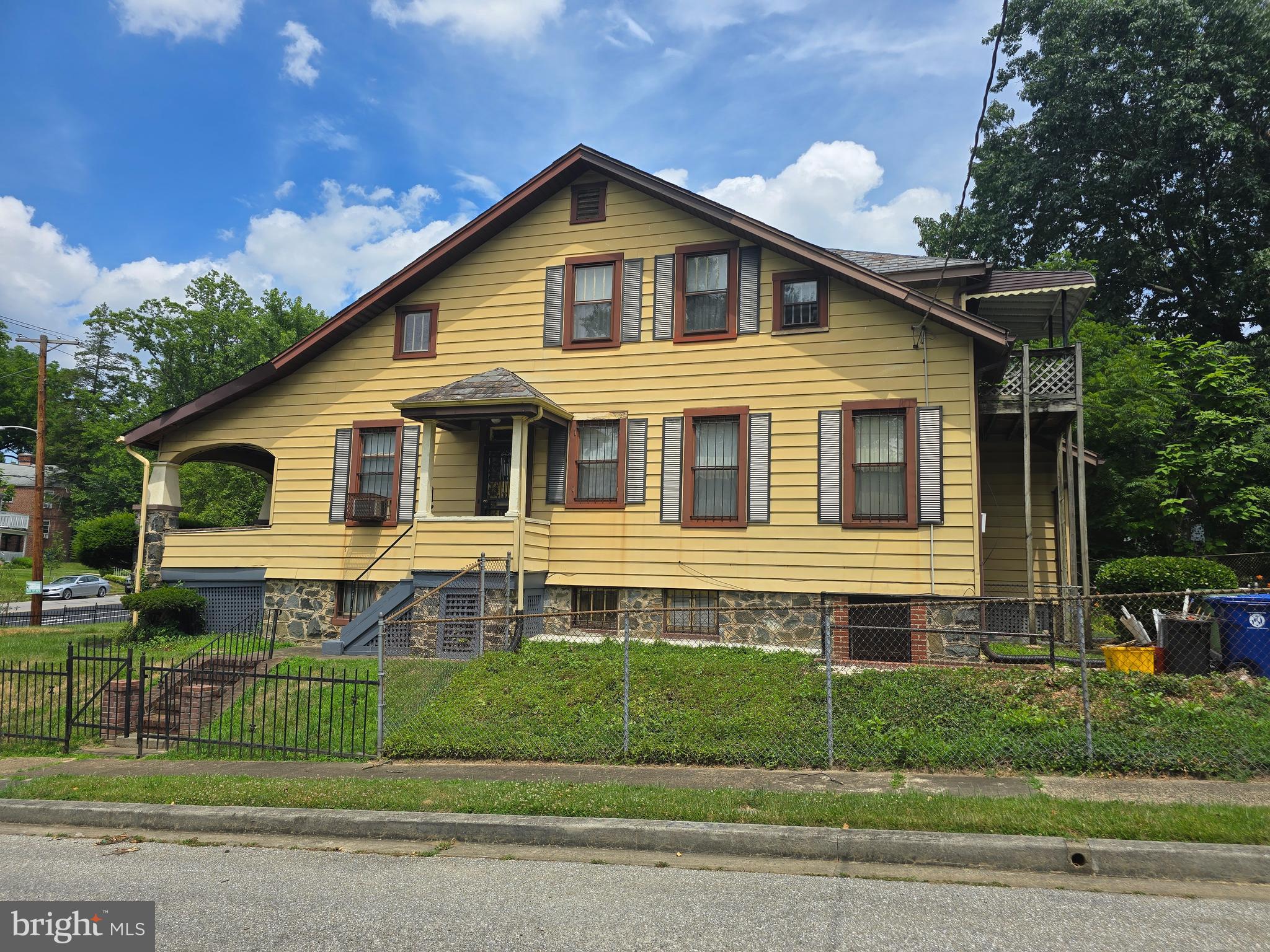 5533 Gwynn Oak Baltimore, MD 21207 - Photo 5 of 44 a front view of a house with a garden