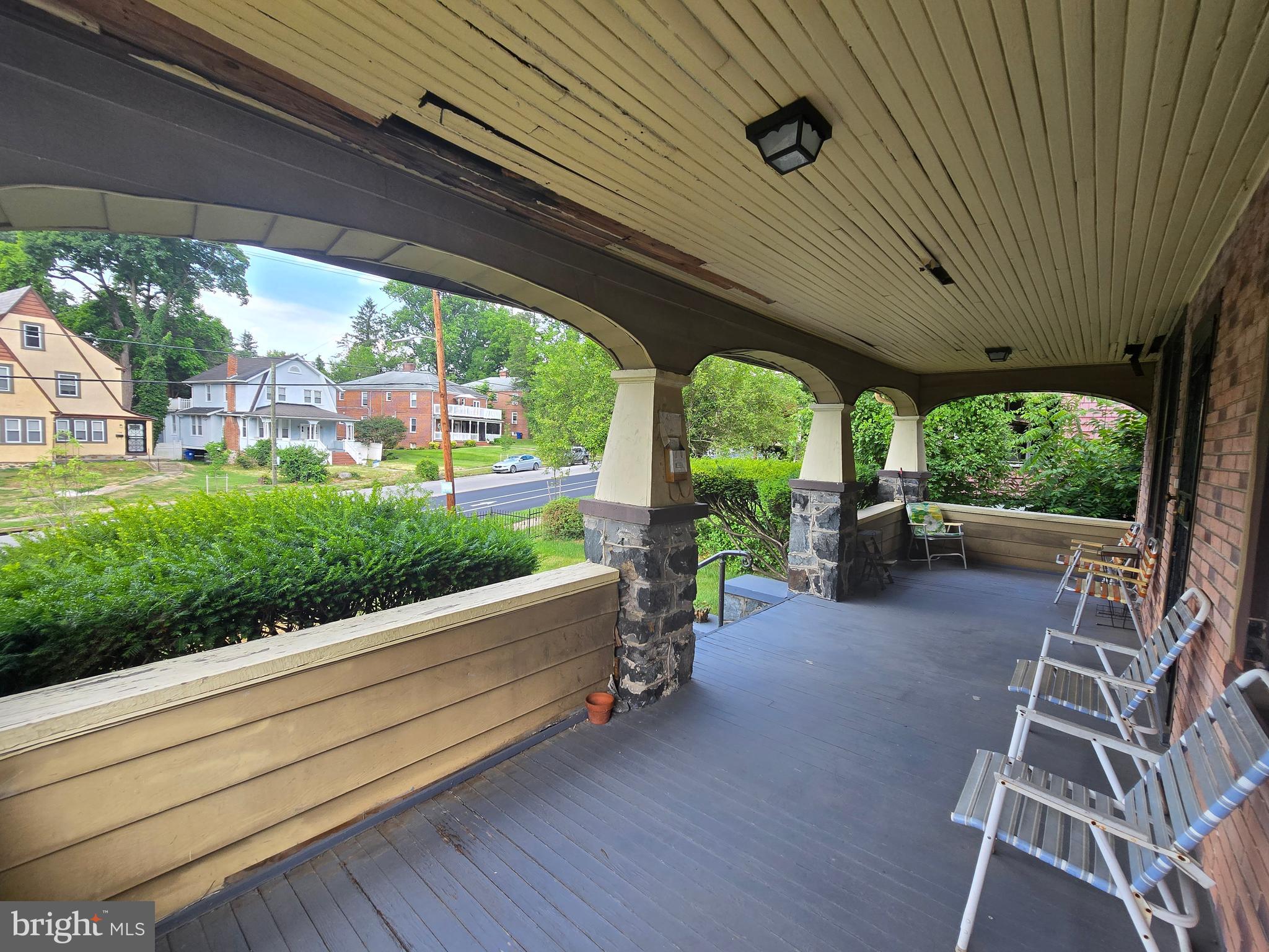 5533 Gwynn Oak Baltimore, MD 21207 - Photo 9 of 44 a view of a patio with lawn chairs next to a yard