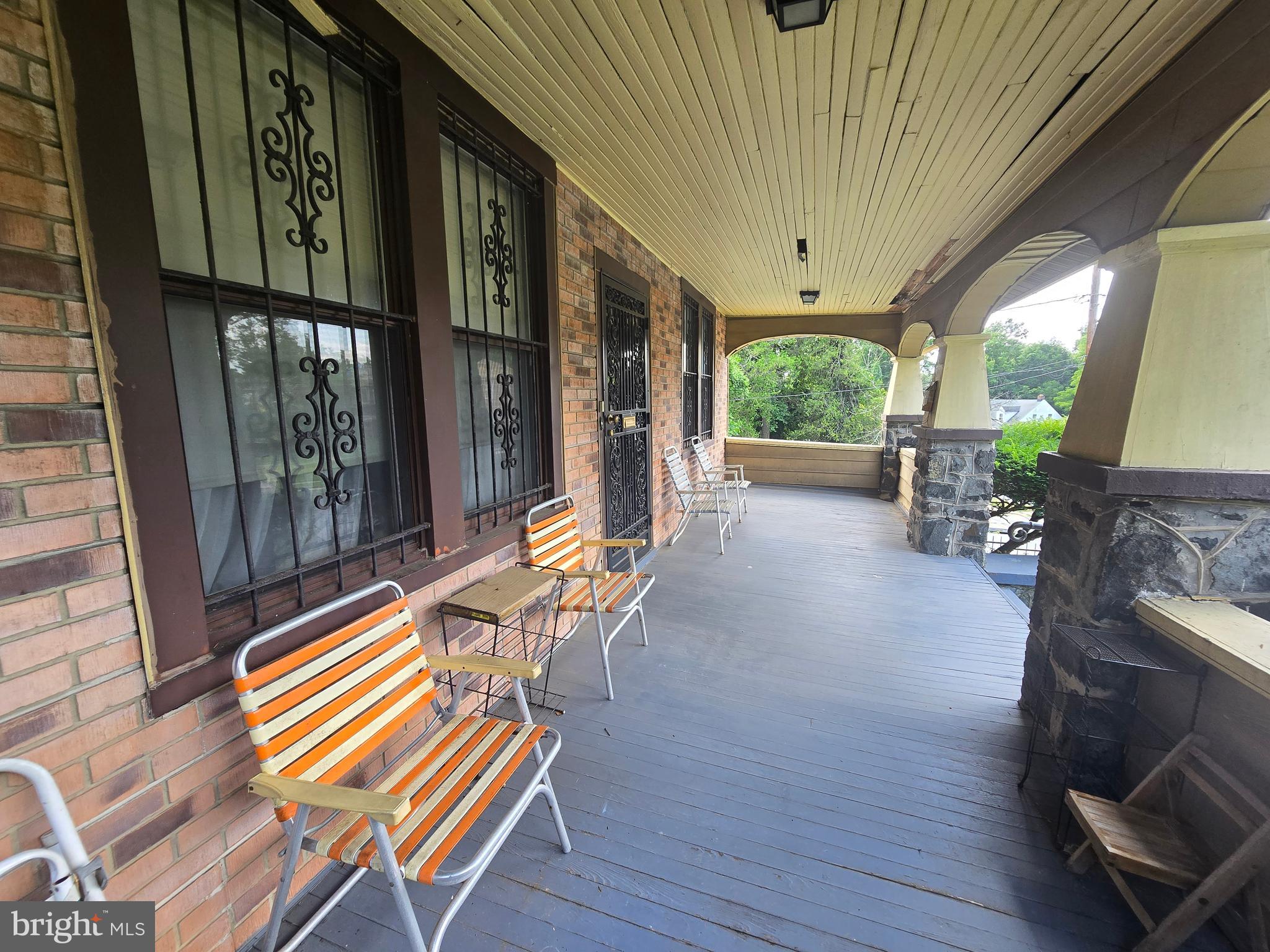 5533 Gwynn Oak Baltimore, MD 21207 - Photo 10 of 44 a sitting area with furniture and wooden deck