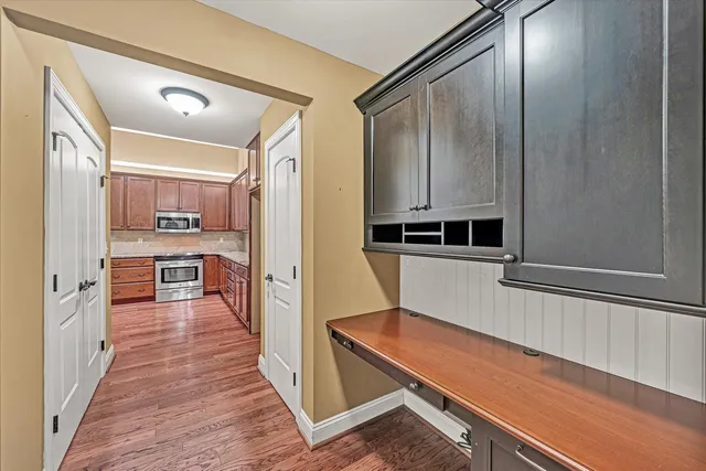 a kitchen with stainless steel appliances a refrigerator and cabinets