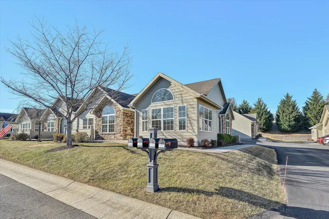 a front view of a house with a yard