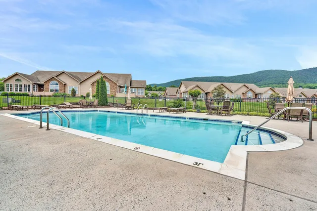 a view of swimming pool from a balcony