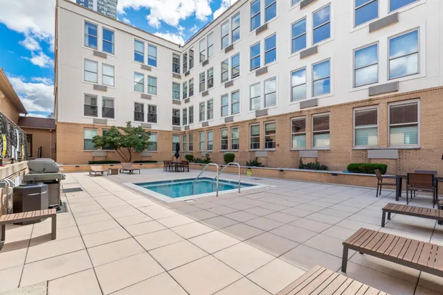 a view of a building with sitting area
