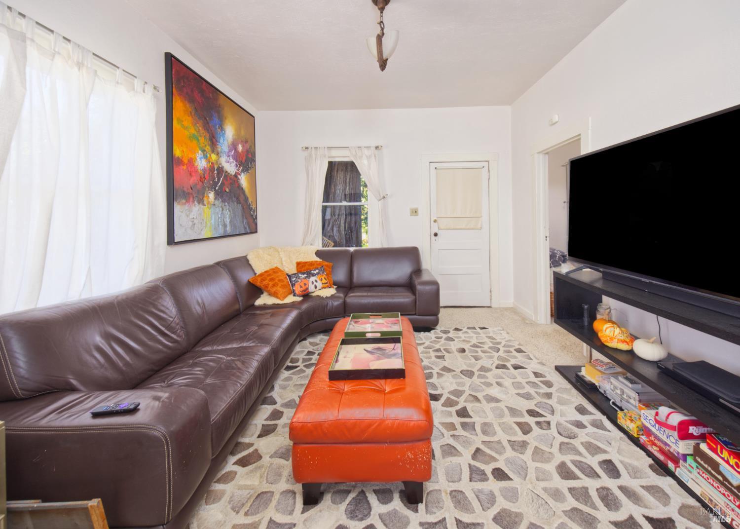 1623 Willowside Road Santa Rosa, CA 95401 - Photo 15 of 47 a living room with furniture and a flat screen tv