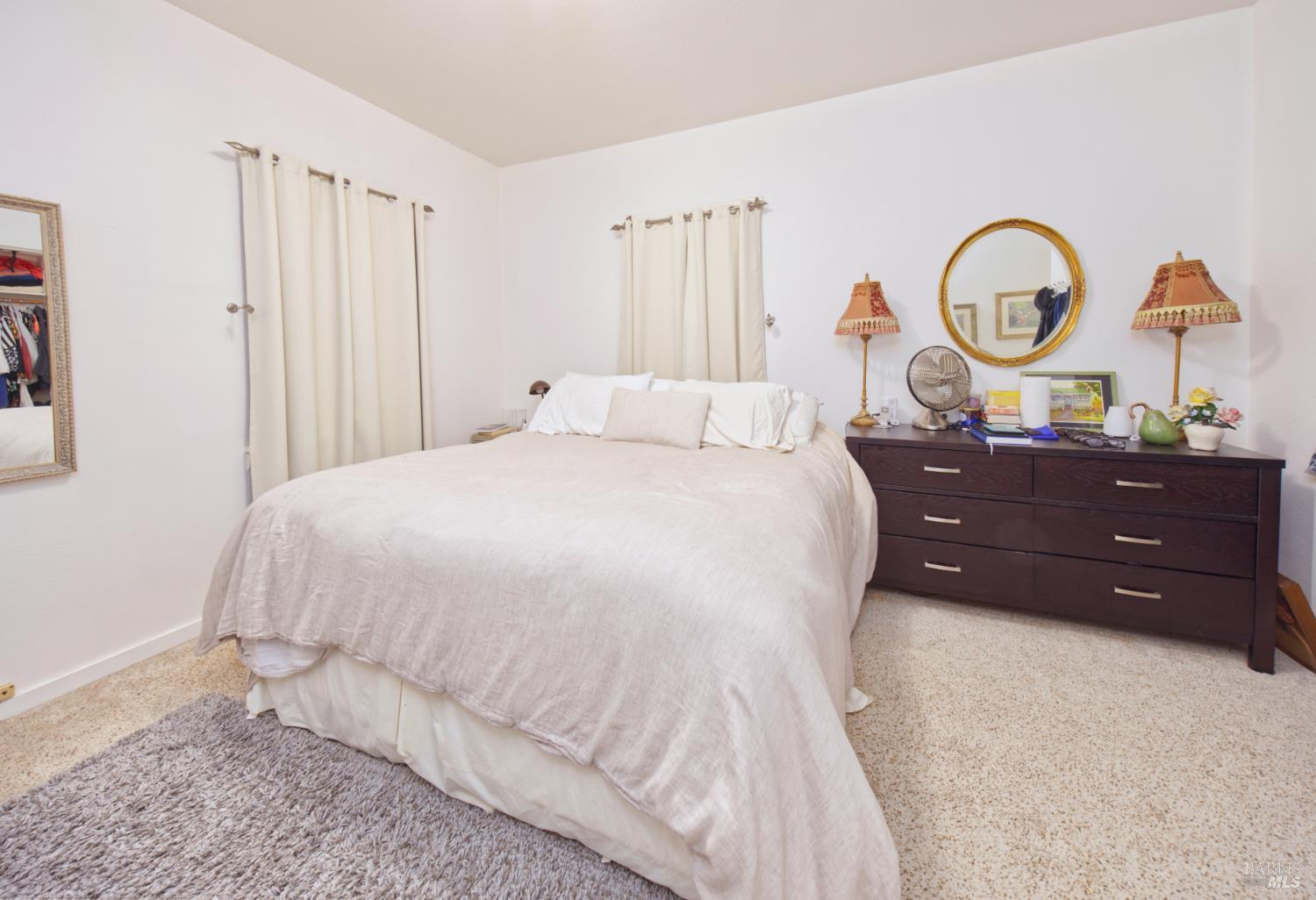 1623 Willowside Road Santa Rosa, CA 95401 - Photo 18 of 47 a bed room with a bed and a dresser