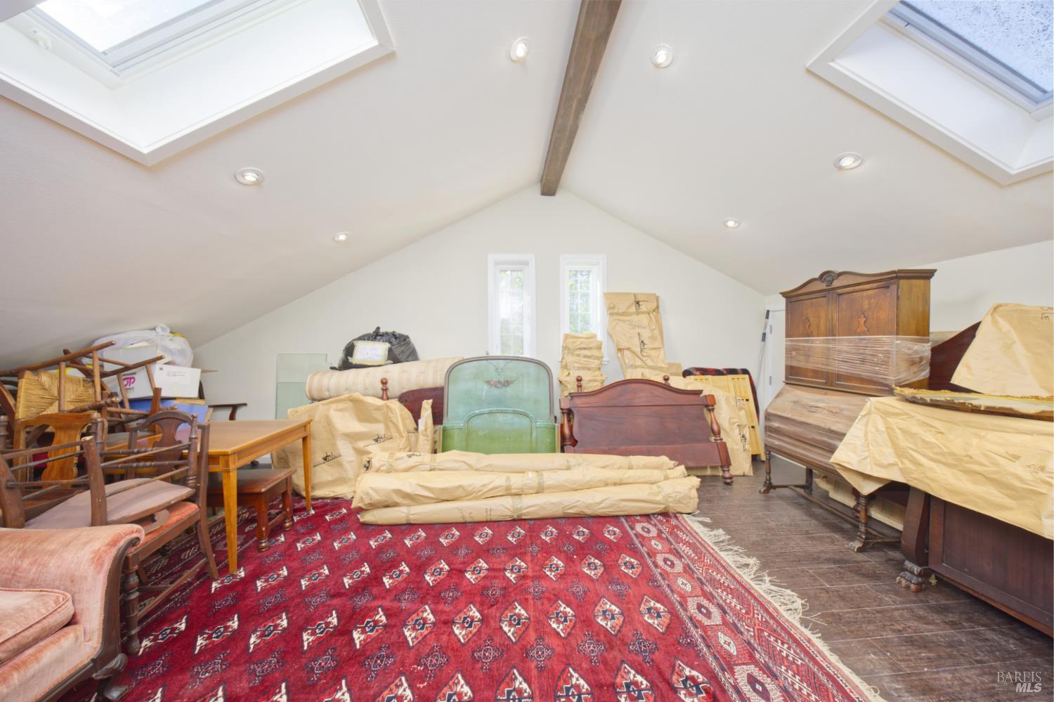 1623 Willowside Road Santa Rosa, CA 95401 - Photo 29 of 47 a bedroom with a bed and wooden floor